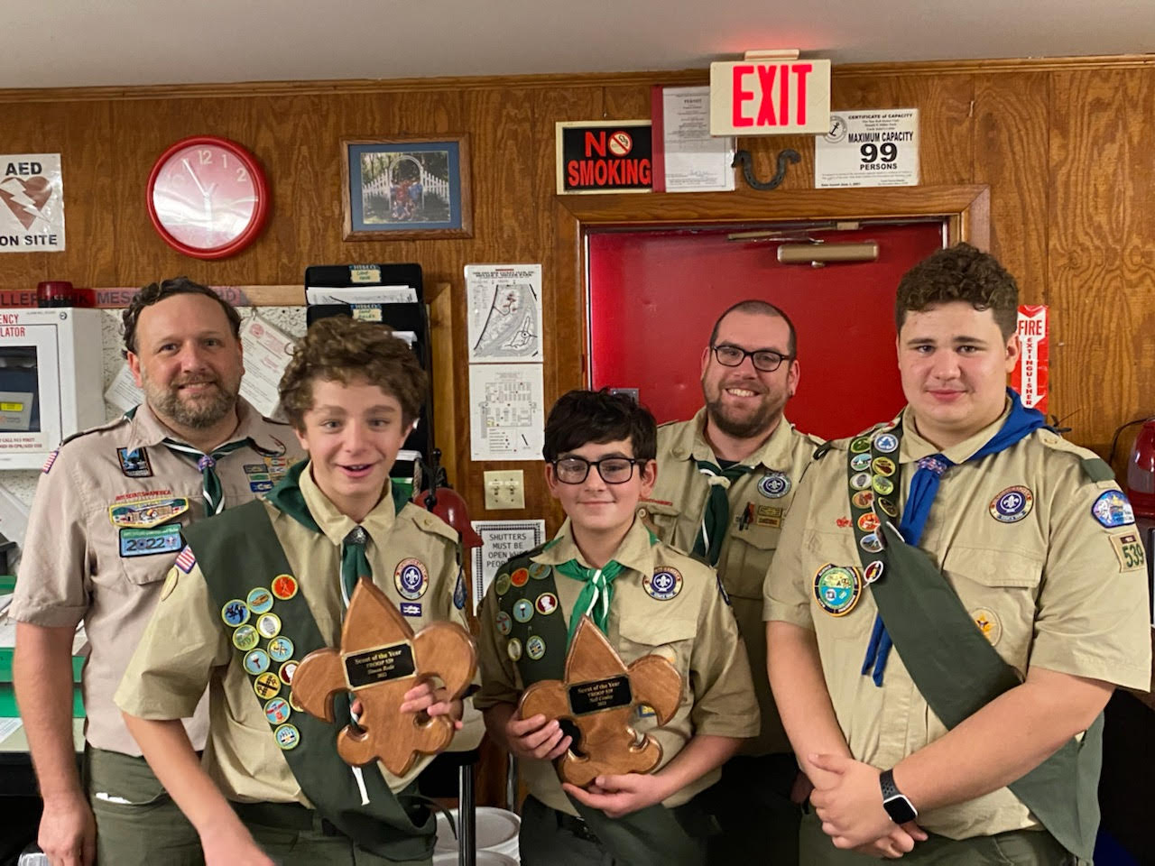 Rob, Simon, Neil, Dan, and Paul posing with scout of the year for Simon and Neil